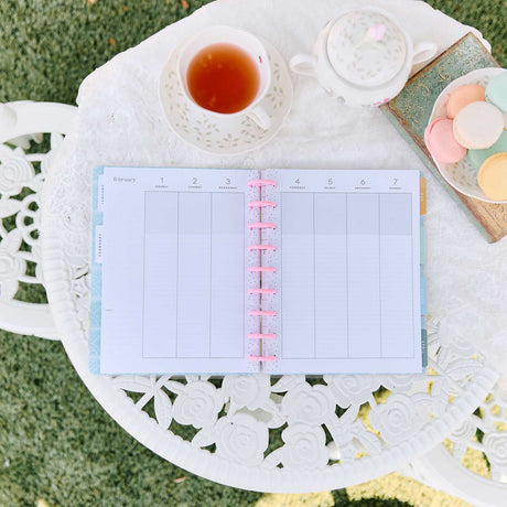 Happy Planner Life In Whimsy Classic Lined Vertical Planner 2027: Weekly spread beside tea and macarons