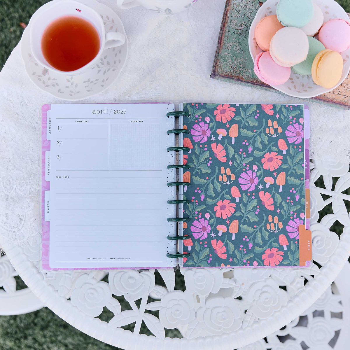 Happy Planner Hive & Bloom Classic Vertical Planner 2027: Monthly spread beside the floral cover