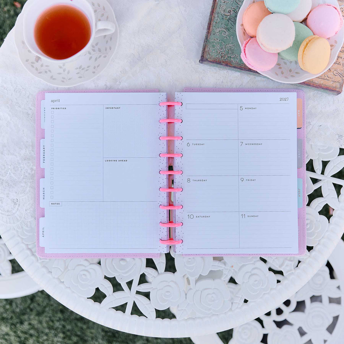 Petal Press planner monthly spread with pink discs on a decorative table