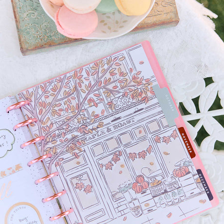 Deluxe Seasonal Sidewalks planner open to an illustrated Maple and Toast seasonal page