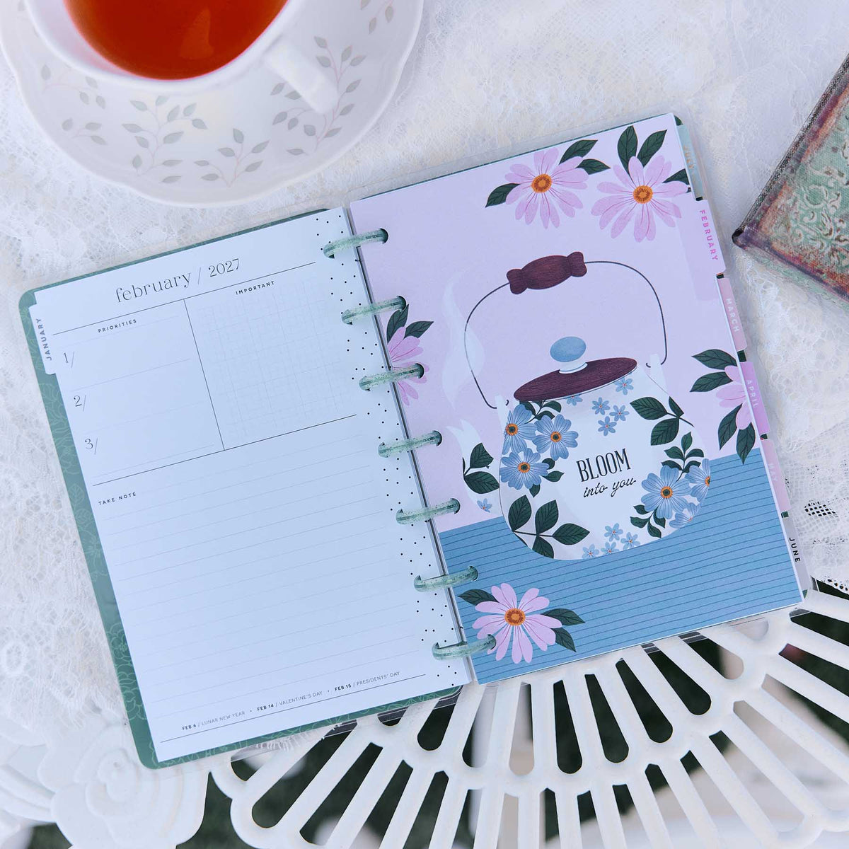 Petal Press Mini planner open to a floral February 2027 monthly spread
