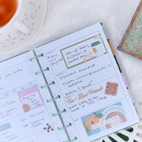 Happy Planner Petal Press weekly spread with handwritten plans and floral stickers
