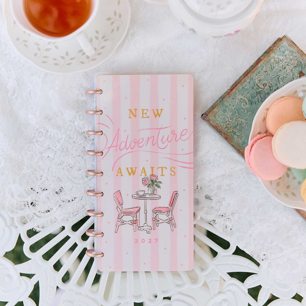 Seasonal Sidewalks Skinny Classic New Adventure Awaits cover beside tea and macarons