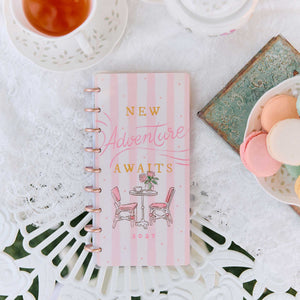 Seasonal Sidewalks Skinny Classic New Adventure Awaits cover beside tea and macarons