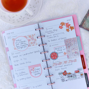 Seasonal Sidewalks Skinny Classic illustrated weekly pages with handwritten plans beside tea