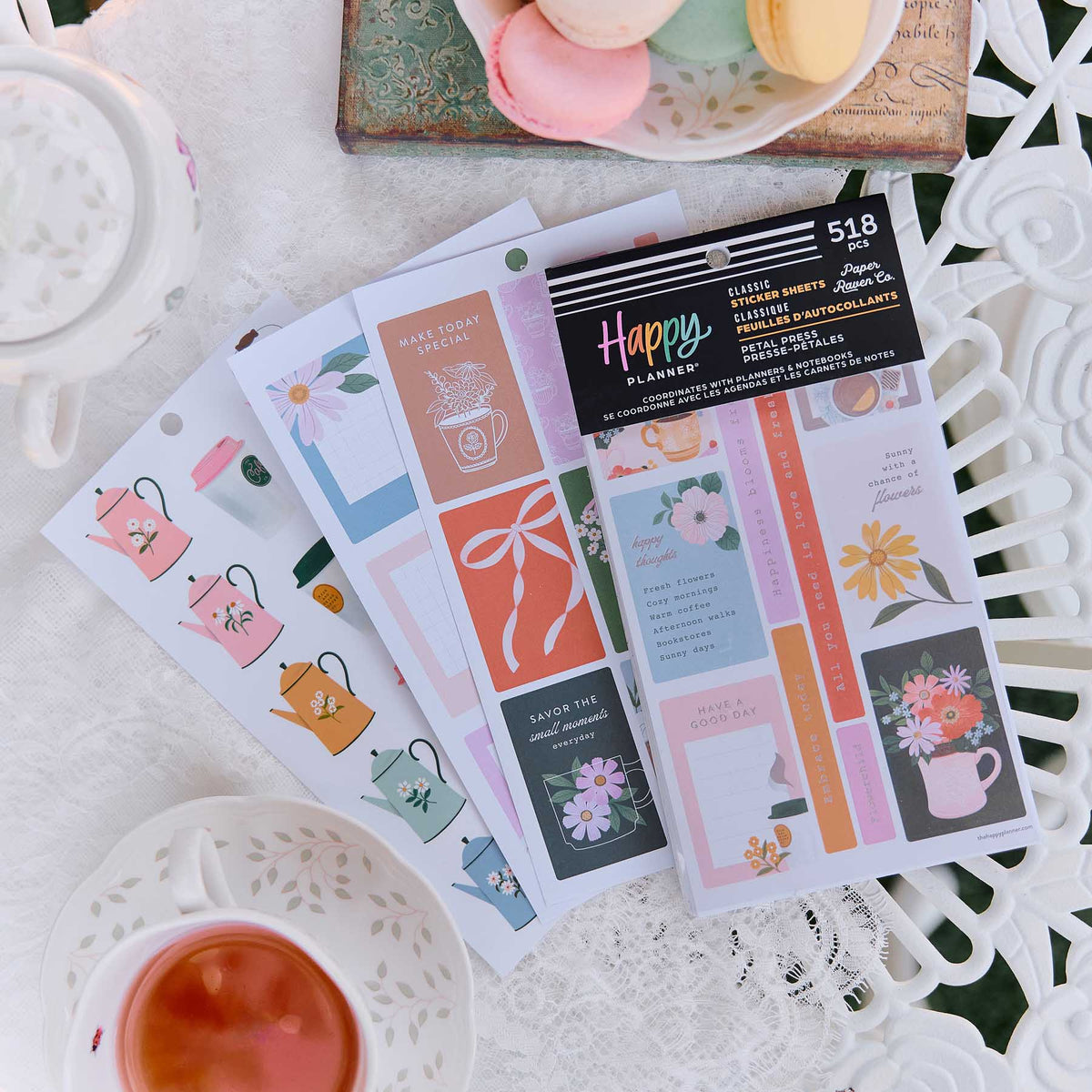Petal Press pastel floral stickers beside teacups and stationery