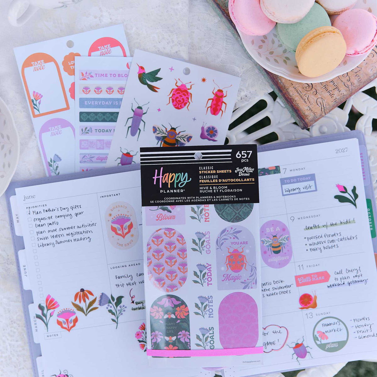 Hive & Bloom sticker book on decorated planner pages with floral labels and garden insect designs
