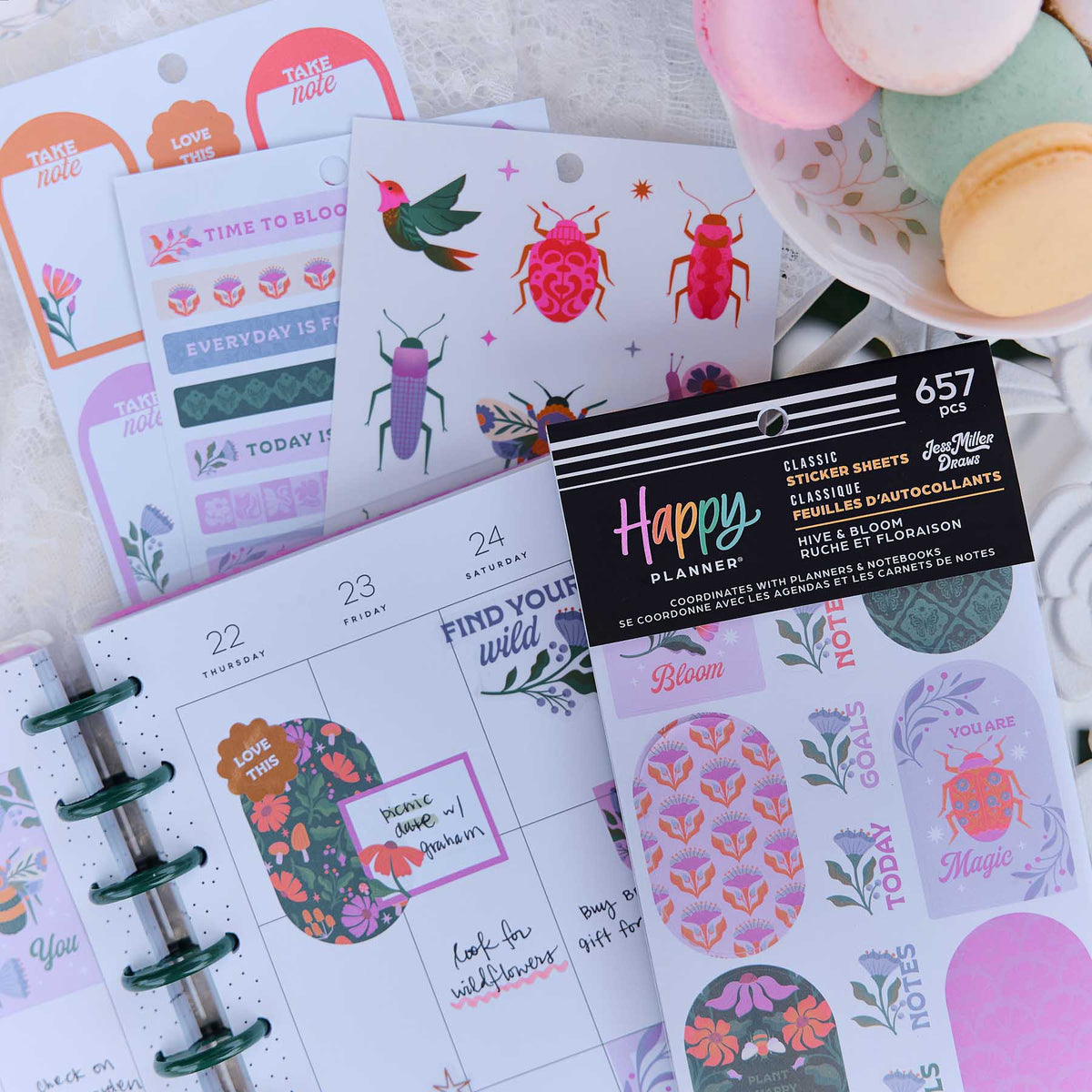 Happy Planner weekly spread decorated with Hive & Bloom floral boxes, beetles and colourful labels