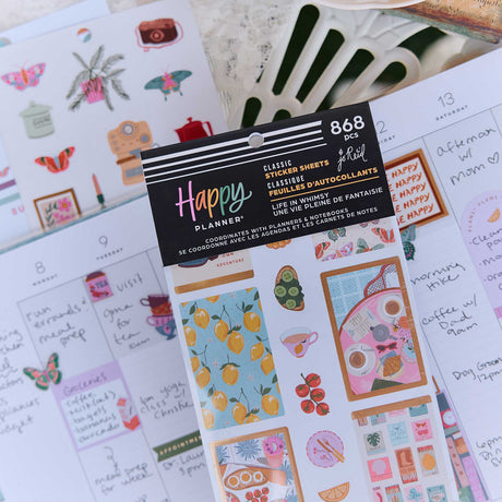 Life In Whimsy sticker book with lemon and food designs on a decorated weekly planner spread