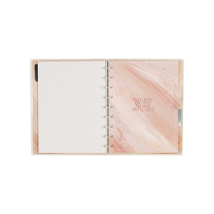 Starlit Glow notebook open to dotted-lined paper with a soft pink cover