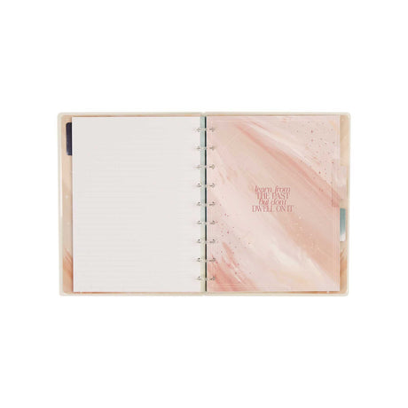 Starlit Glow notebook open to dotted-lined paper with a soft pink cover