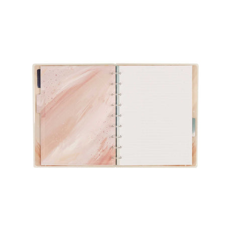 Open Starlit Glow notebook with a pink marbled interior cover and dotted-lined pages