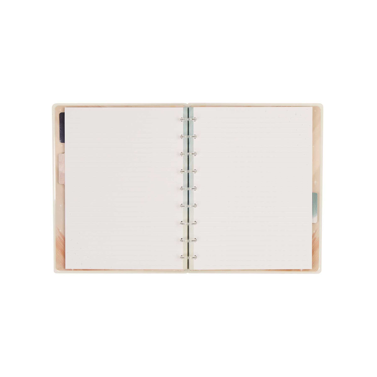 Open Starlit Glow notebook showing dotted-lined pages and disc binding