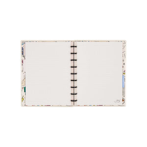 Open Pajama Plans notebook showing dotted-lined pages, illustrated borders and black discs