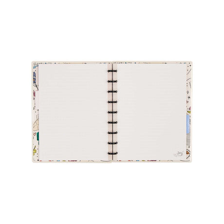 Open Pajama Plans notebook showing dotted-lined pages, illustrated borders and black discs