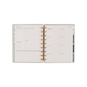 Wildflower Daydream Faith Planner open to a guided weekly layout with disc binding