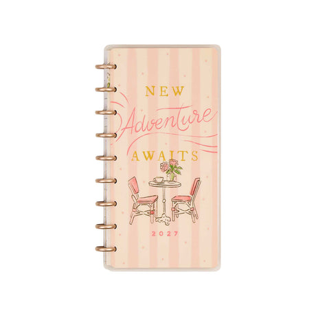 Seasonal Sidewalks Skinny Classic planner peach striped cover with New Adventure Awaits lettering and café illustration