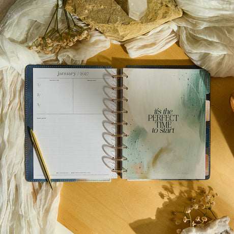 Starlit Glow planner January 2027 spread with celestial watercolour artwork