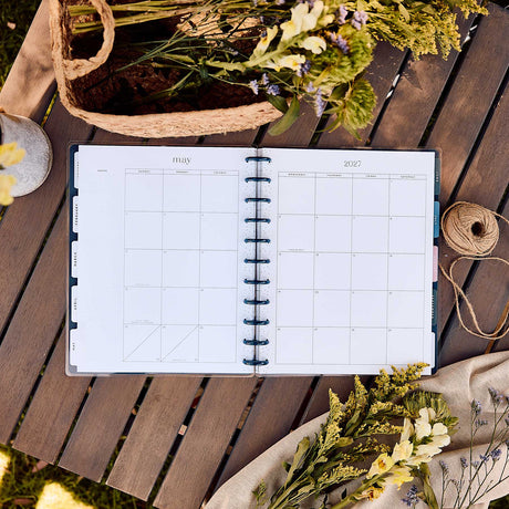 Wildflower Daydream Big monthly spread beside dried wildflowers on a wooden table