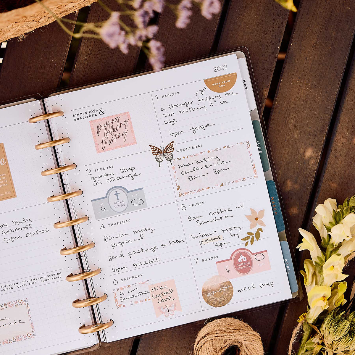 Wildflower Daydream Faith Planner open with weekly faith notes and floral artwork