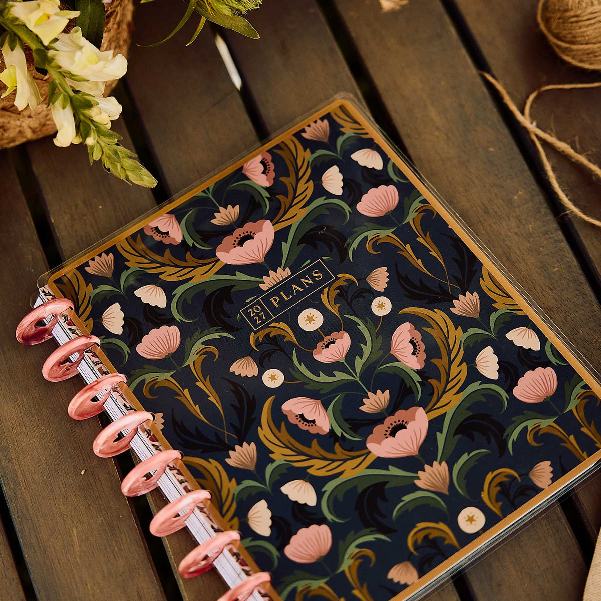 Happy Planner Twilight Tapestry Classic Horizontal Planner 2027: Dark floral cover on a wooden table