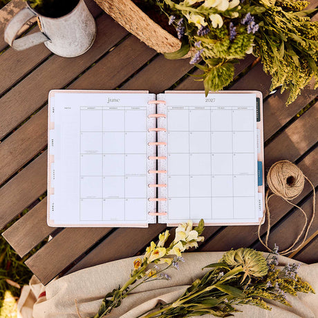 Wildflower Daydream planner monthly spread with floral styling and metallic discs