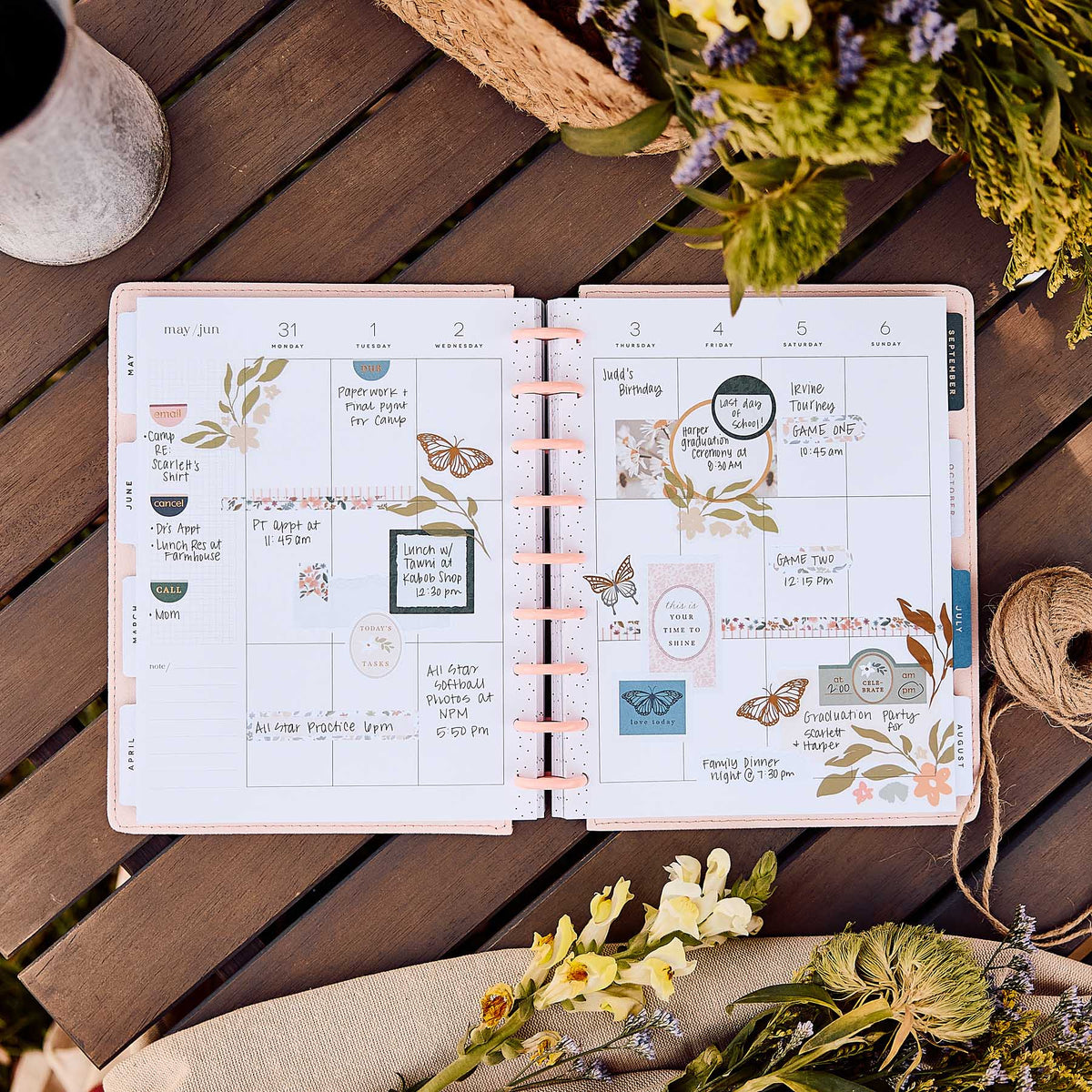 Wildflower Daydream planner decorated floral monthly spread on a wooden table