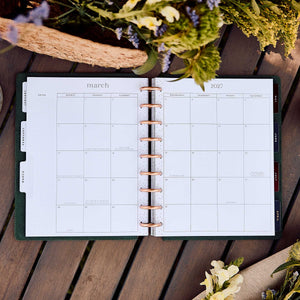 Twilight Tapestry monthly calendar spread with disc binding and floral styling