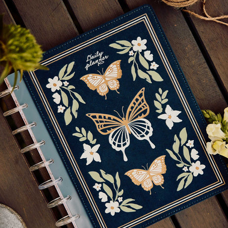 Happy Planner Wildflower Daydream Classic Dashboard Planner 2027 - navy floral butterfly cover displayed with clear discs