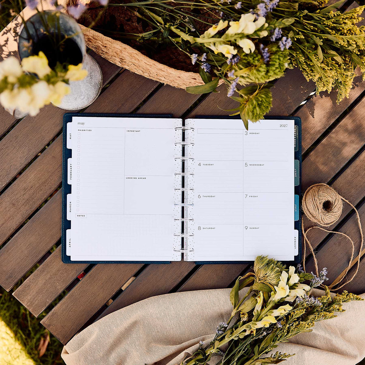 Happy Planner Wildflower Daydream Classic Dashboard Planner 2027 - open planner with floral pages on a wooden table