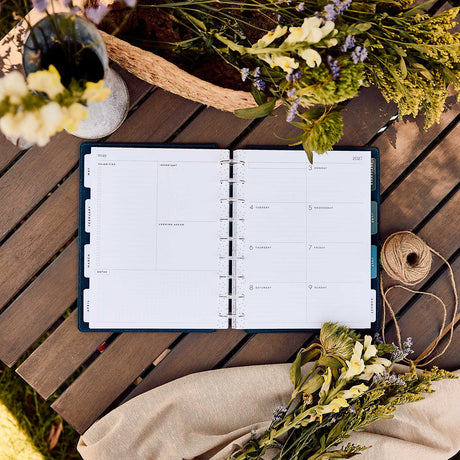 Happy Planner Wildflower Daydream Classic Dashboard Planner 2027 - open planner with floral pages on a wooden table