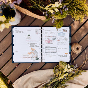 Happy Planner Wildflower Daydream Classic Dashboard Planner 2027 - monthly dashboard with handwritten notes and stickers beside dried flowers