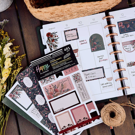 Twilight Tapestry floral stickers on an open disc-bound planner with vintage-inspired designs