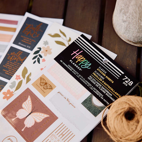 Close-up of Wildflower Daydream Faith sticker book and botanical faith quotes on a wooden table