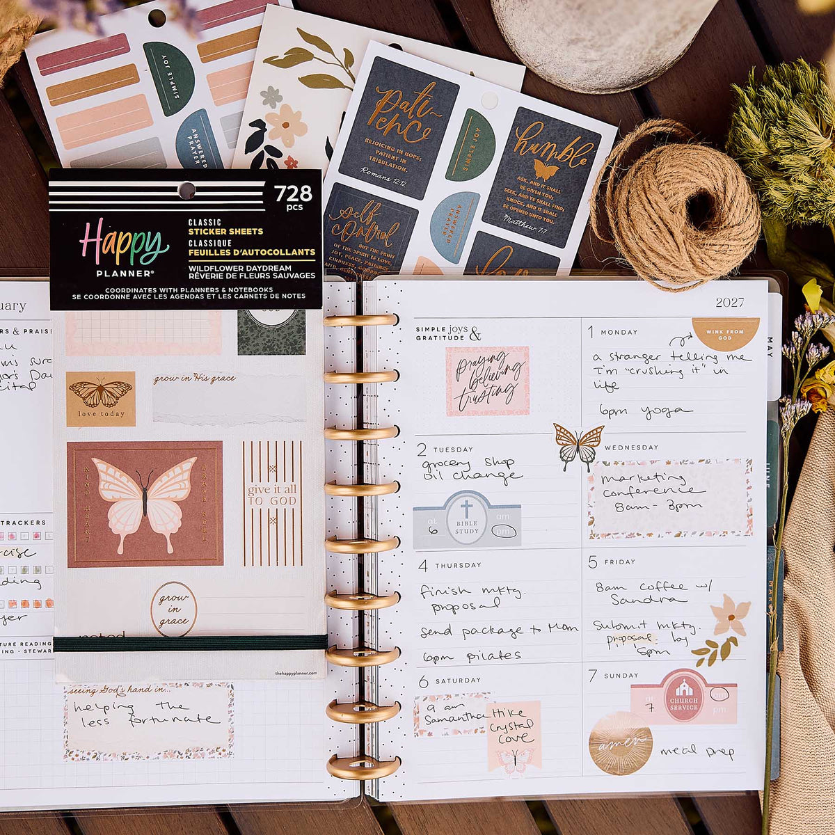 Happy Planner Wildflower Daydream Faith sticker book on a weekly spread decorated with quotes and butterflies