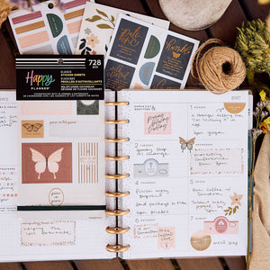 Happy Planner Wildflower Daydream Faith sticker book on a weekly spread decorated with quotes and butterflies