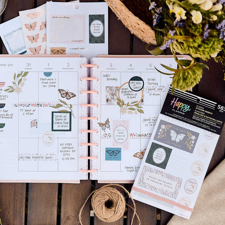 Happy Planner weekly spread decorated with Wildflower Daydream florals, butterflies and pastel boxes