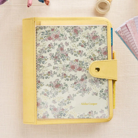 Erin Condren planner folio: Butter folio holding a floral cover planner