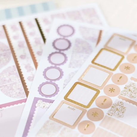 Erin Condren sticker book: Close-up of pastel labels, circles and decorative stickers