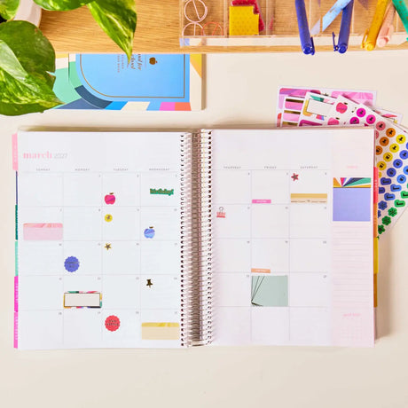Erin Condren sticker book: School planning stickers used on an open calendar