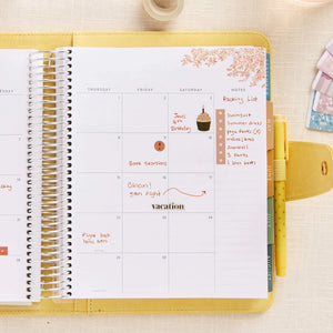 Erin Condren planner folio: Open folio holding a planner on a weekly spread