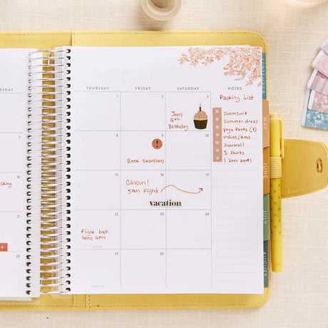 Erin Condren planner folio: Open folio holding a planner on a weekly spread