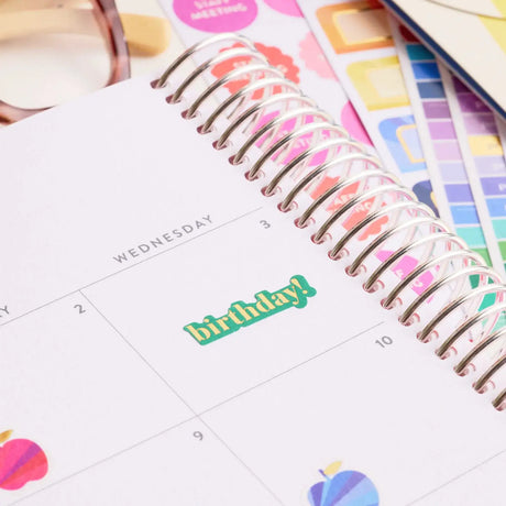 Erin Condren sticker book: Close-up of a birthday label on a planner page
