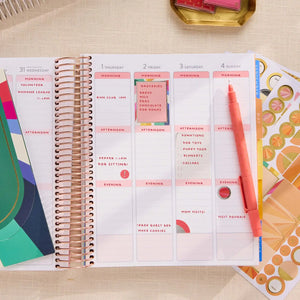 Erin Condren sticker book: Close-up of a weekly spread decorated with planning stickers
