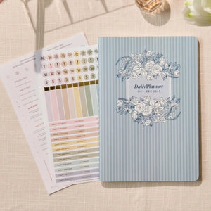 Erin Condren Petite Planner: Quarterly planner cover beside included sticker sheets