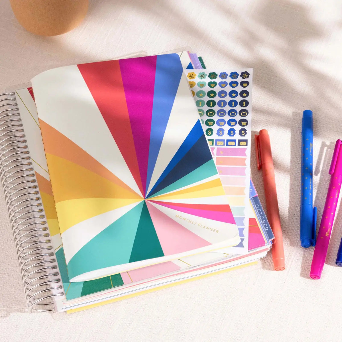 Erin Condren Petite Planner: Monthly Petite Planner beside pens and stickers