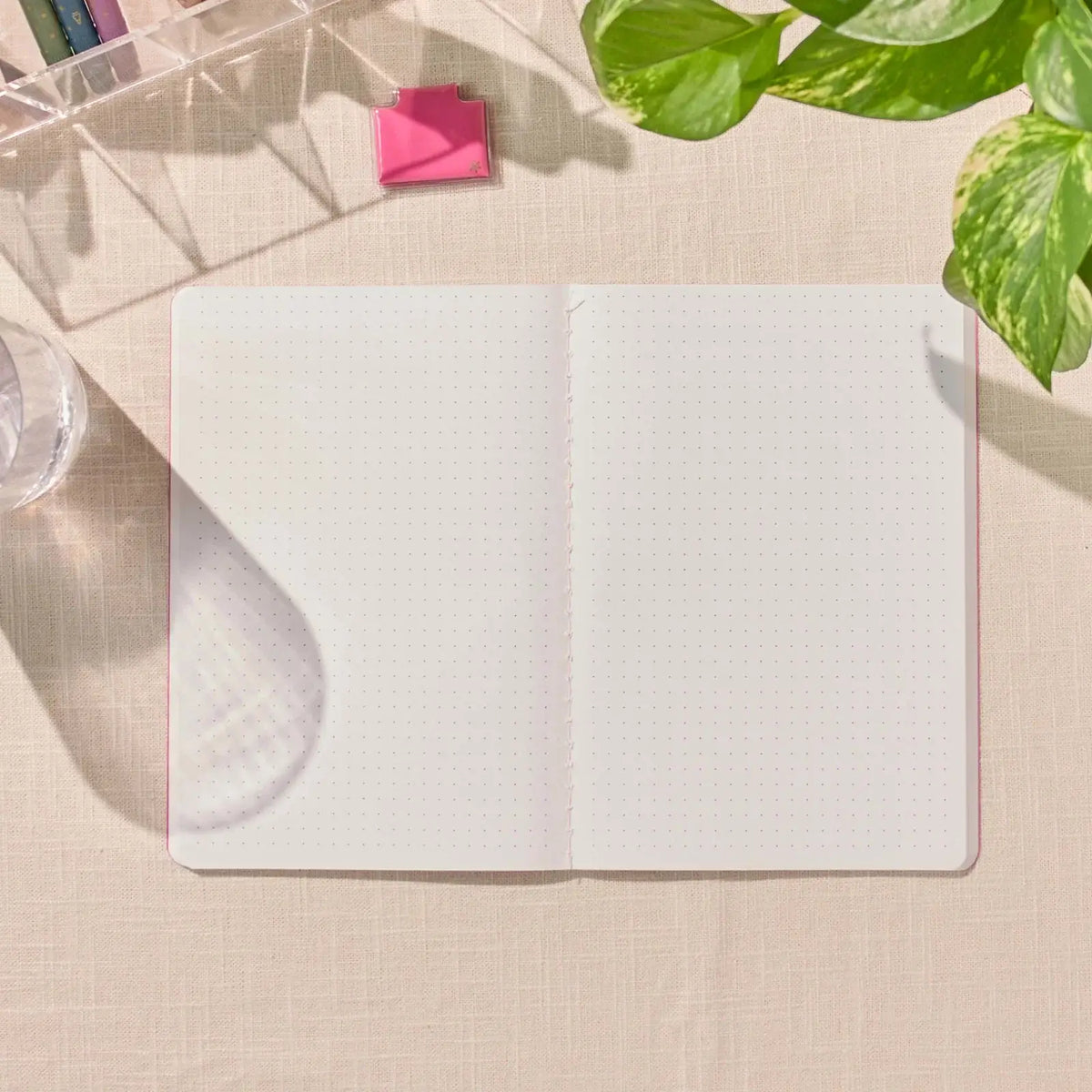 Erin Condren Petite Journal: Open dot grid journal on a desk