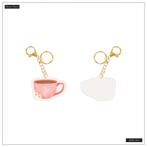 Front and back of the Coffee Planner Charm with pink floral cup design and gold-tone clasp
