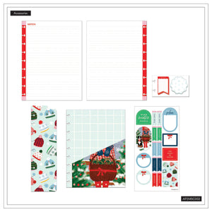 Collection of Christmas-themed stationery items including a planner cover, stickers, and a ruler on a white background.