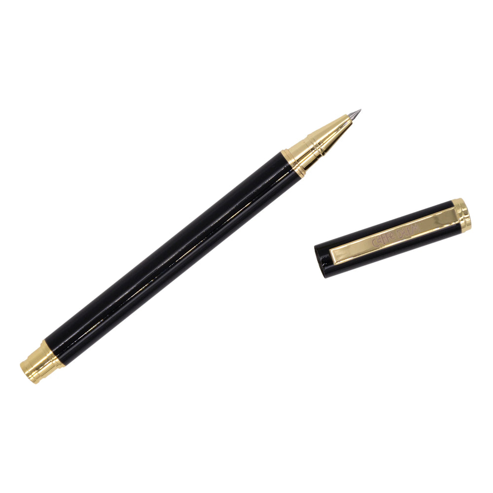 Black pen with gold accents on a white background